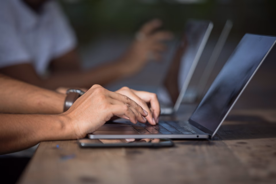 A laptop on a workspace desk