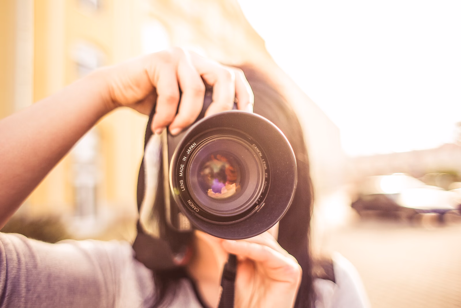 A photographer holding a camera