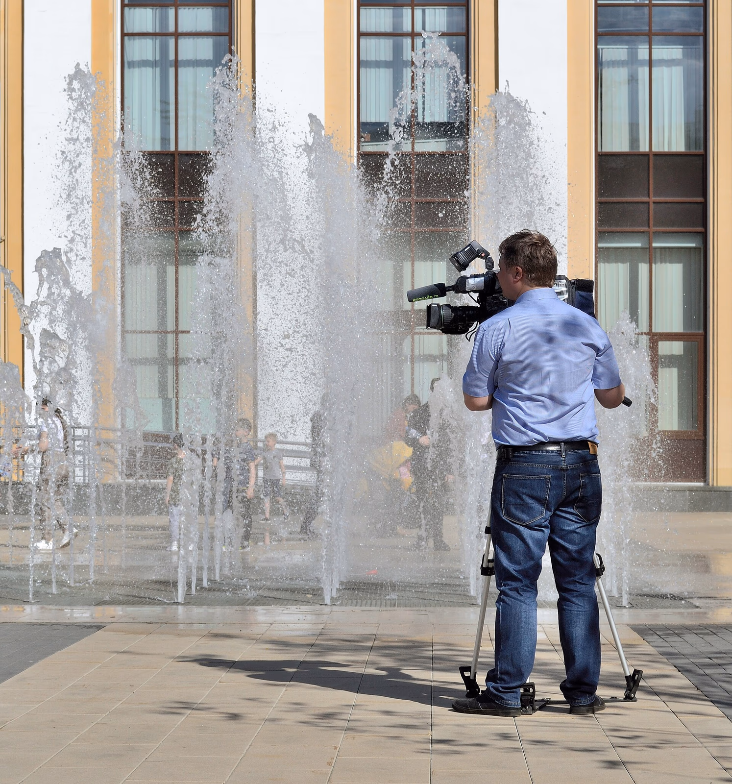 Camera operator at fountain in Korolyov