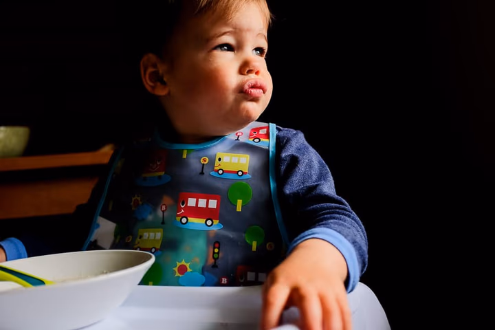 A child photographed in close-up, capturing genuine expression and detail