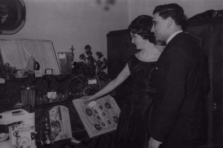 A couple gazing upon the gifts received to mark their engagement